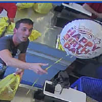 <p>Stamford police are trying to identify the man pictured, who is accused by police of using a cloned credit card.</p>