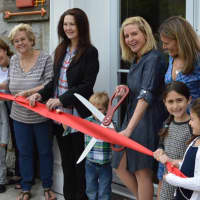 <p>Joined by Ridgewood officials and HealthBarn USA Founder Stacey Antine, Councilwoman Gwenn Hauck cuts the ribbon on the new village location.</p>
