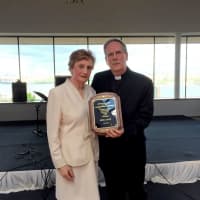 <p>honoree Sheila Lally and Fr. Ken Evans</p>