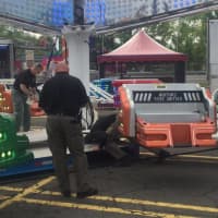 <p>State Troopers with the Fire &amp; Explosion Investigation Unit inspect carnival rides at the Danbury Fair Mall last month. This is one duty for the State Police unit.</p>
