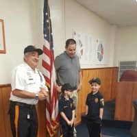<p>After being sworn in as Emerson&#x27;s police chief for a day, Hugh Hennessey named his sister, Emma, captain. Here with their dad and Police Chief Donald Rossi.</p>