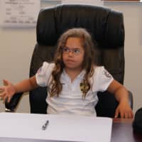 <p>Montvale Police &quot;Chief For a Day&quot; Eva Martinez takes Police Chief Jeremy Abrams&#x27;s chair.</p>