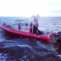 <p>A crew from Stratford Fire Department Marine Unit sharing pertinent information about the search with the crew from USCG Station New Haven.</p>