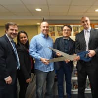 <p>New Rochelle Schools Superintendent Brian Osborne and Ward Elementary Principal Franco Miele cutting the ribbon at the new library.</p>