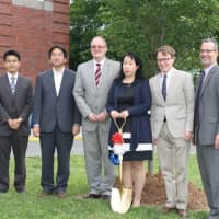 <p>Eastchester parent Chiaki Umemoto with members of the school administration at the sakura cherry tree planting.</p>