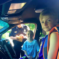<p>Simon and Cooper, two Fox Run Elementary School students, where the lucky winners of a raffle to ride to school with the police chief.</p>
