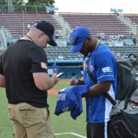 <p>Former New York Giants running back, Ahmad Bradshaw, signs his autograph for a fan at Brad Wing&#x27;s Celebrity Softball Game at Dutchess Stadium.</p>