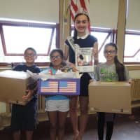 <p>Izabela Hasandjekic donates goodies to Cliffside Park School No. 3 for its next set of care packages for troops.</p>