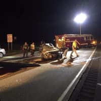 <p>The Nichols Fire Department helps at the scene of a crash at Exit 9 on Route 25 early Sunday.</p>