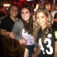 <p>From left: Ashely Collazo, Jess Mirto and Vitoria Bernardes sit at the bar at Michael&#x27;s Tavern.</p>