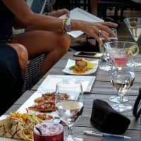 <p>Digging in on the rooftop deck at Winston Restaurant in Mount Kisco.</p>