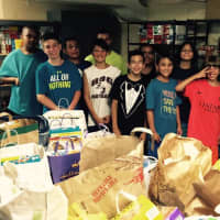 <p>Summer campers help unload donations to the Sterling House Food Pantry which is currently in need of donations of all kinds of food.</p>