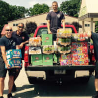 <p>Stratford firefighters drop off donations for campers and for the food pantry at Sterling House which is currently in need of food.</p>