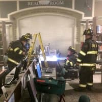 <p>Firefighers and library staff used hand-held extinguishers to snuff the flames.</p>