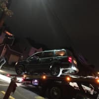 <p>The vehicle was removed by flatbed tow truck.</p>