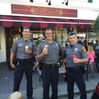 <p>Ridgefield police eating ice cream at Deborah Ann’s Cops and Cones event.</p>