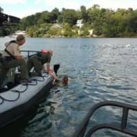 <p>Divers from Brookfield Police Department&#x27;s dive team went into Candlewood Lake on Sept. 2 to find a boat that sank after a fire.</p>