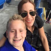 <p>Nadine Shanker Haruni and her son, Jacob, who sang &quot;America The Beautiful&quot; at the U.S. Open.</p>