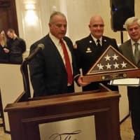 <p>Outgoing Saddle Brook Fire Chief Doug Habermann receives a commendation for his two years of service.</p>