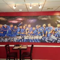 <p>Cricket photos hang on the walls of Silli Point Indian Fusion in Cliffside Park.</p>