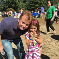 <p>Father and daughter enjoy the North Salem harvest festival.</p>