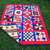 <p>Example of a quilt being presented to a veteran.</p>