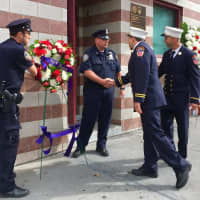 <p>Members of the New York Police Department deliver wreaths to honor Michael Fahy who was killed Tuesday during an explosion in the Bronx.</p>
