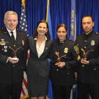 <p>Lt. Terry Blake, U.S. Attorney Deirdre Daly, Sgt. Sofia Gulino and Officer Felipe Taborda during a Friday Community Policing Awards ceremony.</p>