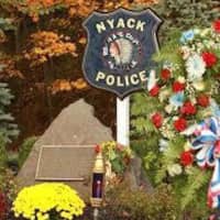 <p>A memorial marks the spot where two Nyack police officers were killed following a Brinks robbery.</p>