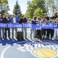 <p>A ceremony marks the reopening of the Bobby Speisman Court in Irvington, N.Y.</p>