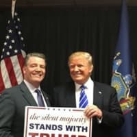 <p>State Sen. Terrence Murphy poses with Donald Trump at a rally in Albany.</p>