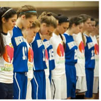 <p>Saddle River Day School and Newtown High School athletes share a moment of silence to remember the 26 victims killed in the Sandy Hook Shooting.</p>