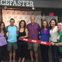 <p>Aidan Walsh, second from left, and his employees during the grand opening of Racefaster in Ridgewood.</p>