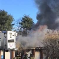 <p>Someone working on a car in one of the units &quot;may have spilled gasoline,&quot; igniting the fire.</p>