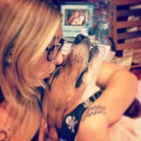 <p>Robyn Hendrix of Hackensack kisses her fur baby.</p>