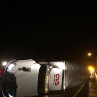 <p>A rolled-over tractor-trailer is closing part of westbound I-84 in Danbury early Wednesday.</p>