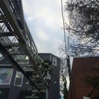 <p>Responders said the worker was fine after firefighters brought him down.</p>