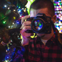 <p>Acito snaps a shot of Vigna behind his Nikon.</p>