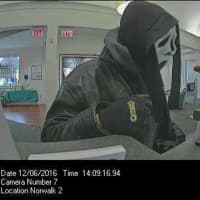 <p>The suspect who robbed the First County Bank in Norwalk was wearing a ghost mask, a black leather jacket, and a black-hooded sweatshirt.</p>