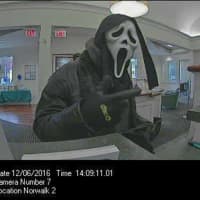 <p>The suspect who robbed the First County Bank in Norwalk was wearing a ghost mask, a black leather jacket, and a black-hooded sweatshirt.</p>
