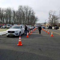<p>Hospital-bound line up outside of the Closter Police Department to be loaded with toys.</p>