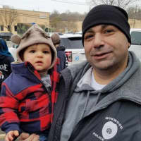 <p>The drive was a family affair for Norwood Police Sgt. Paul Kapu and son, Cameron.</p>