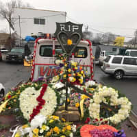 <p>Tow trucks adorned with flowers led a procession for Sal Brescia.</p>
