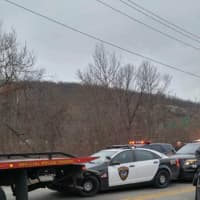 <p>East Rutherford police cruiser dragged by stolen flatbed.</p>