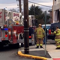 <p>Firefighters got the man down with a bucket ladder.</p>