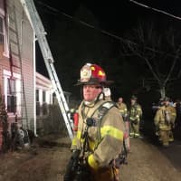 <p>Firefighters from the Bethel and Stony Hill departments respond to a fire Saturday evening on Walnut Hill Road.</p>