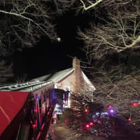 <p>Firefighters from the Bethel and Stony Hill departments respond to a chimney fire Saturday evening on Walnut Hill Road.</p>