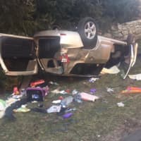 <p>Two people were injured in this one-vehicle rollover crash on Sunday on Weston Road in Weston.</p>