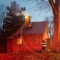 <p>Easton volunteer firefighters respond to a chimney fire on Saturday.</p>