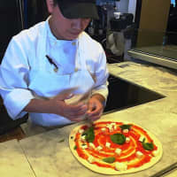 <p>Creating a pizza masterpiece at Tarry Lodge in Wesport.</p>